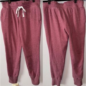 Light maroon sweatpants/joggers with a white tie. Size medium